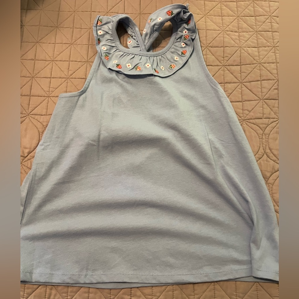Light Blue Sleeveless Top with Floral Accents